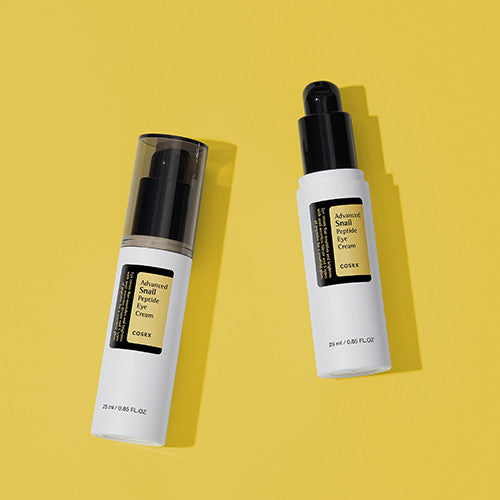 Two bottles of COSRX Advanced Snail Peptide Eye Cream 25ml on a yellow background.