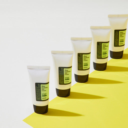 COSRX Aloe Soothing Sun Cream SPF50 PA+++ 50ml tubes arranged on a bright surface, showcasing the product packaging and design.