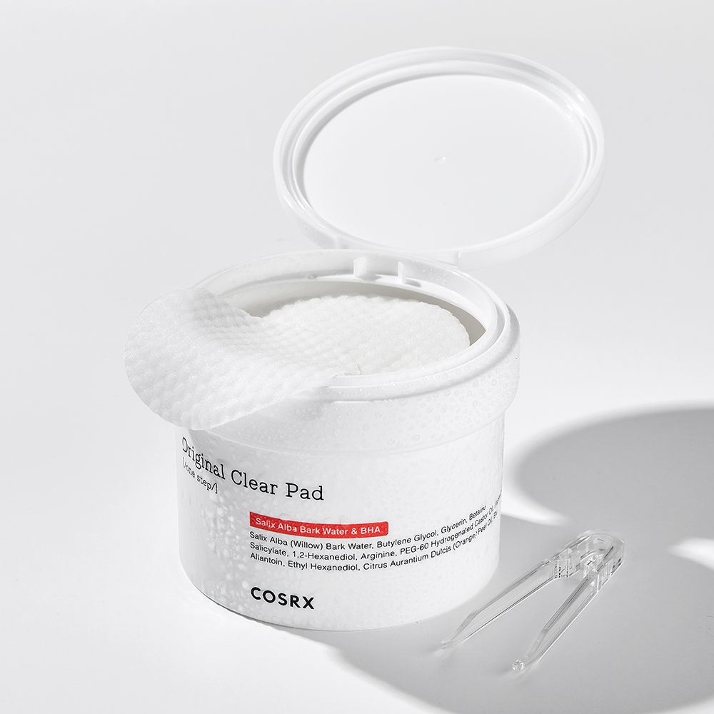 COSRX One Step Original Clear Pad 140ml, open jar showing texture of clear pads with included tweezers, 140ml packaging.