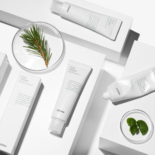 COSRX Pure Fit Cica Cream 50ml display with natural ingredients on a white background.