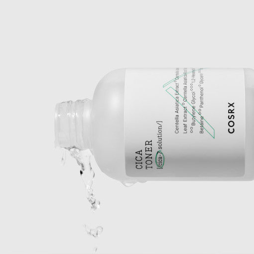 COSRX Pure Fit Cica Toner 150ml pouring liquid in minimalistic design bottle, effective for sensitive skin care routines.