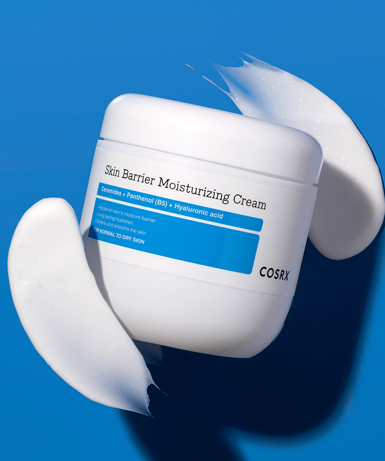 COSRX Skin Barrier Moisturizing Cream 450ml jar with cream texture on blue background