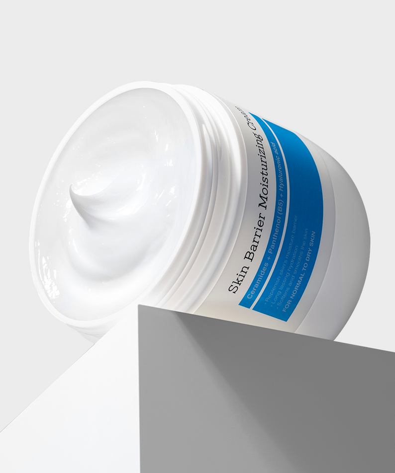 COSRX Skin Barrier Moisturizing Cream 450ml in a white jar with blue label, creamy texture, 450ml size, skincare product