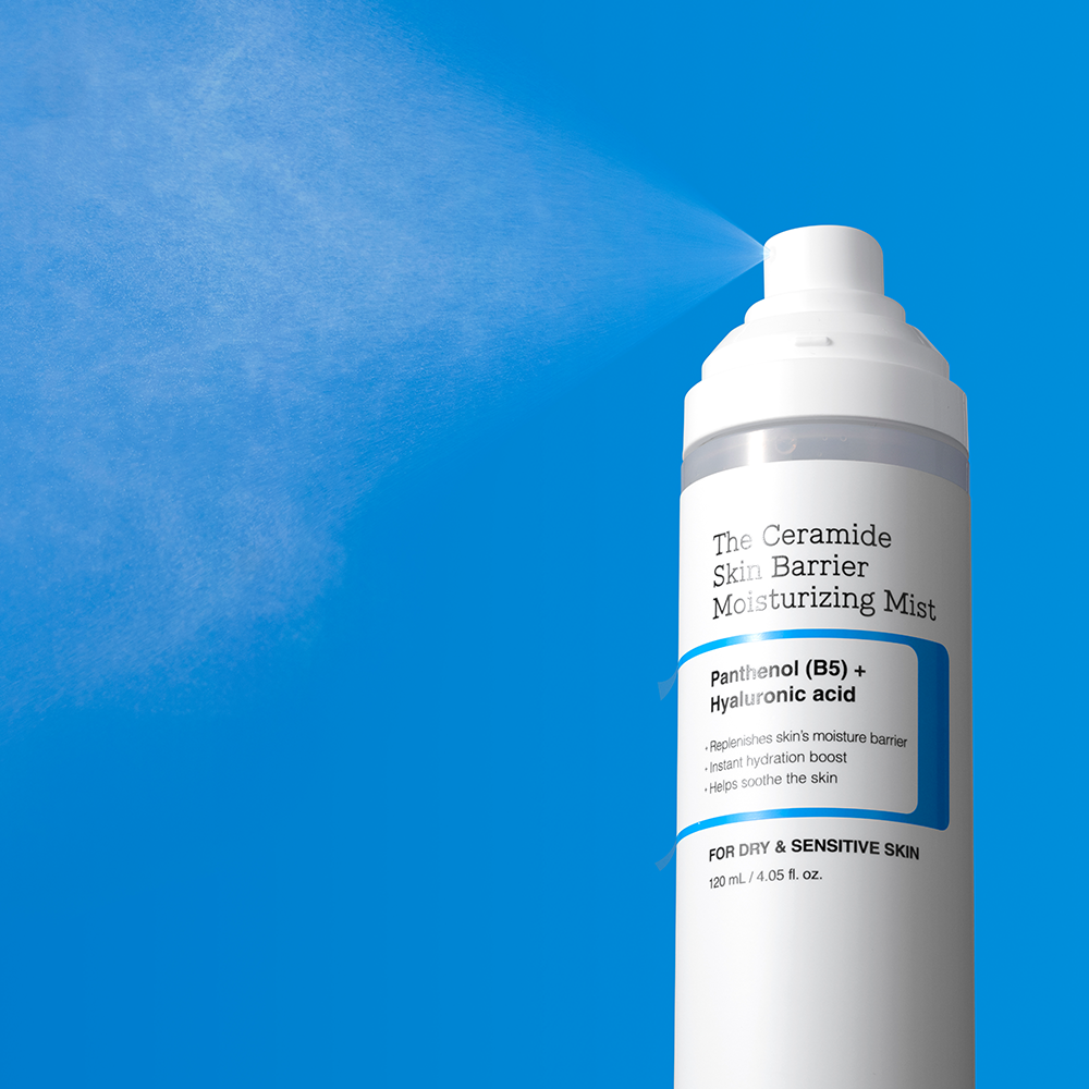 COSRX The Ceramide Skin Barrier Moisturizing Mist 120ml spray bottle on a blue background.