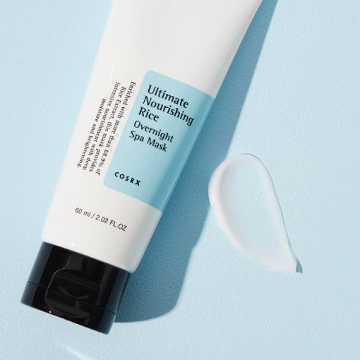 COSRX Ultimate Nourishing Rice Overnight Spa Mask 60ml tube with cream swatch on blue background