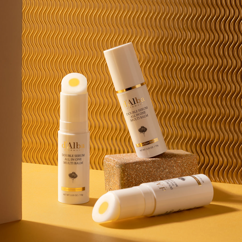 D'ALBA Double Serum All In One Multi Balm 10g displayed on a textured surface.