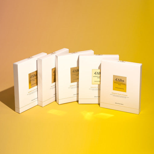 Five boxes of D'ALBA Intensive Liftension Mask on a gradient yellow background.