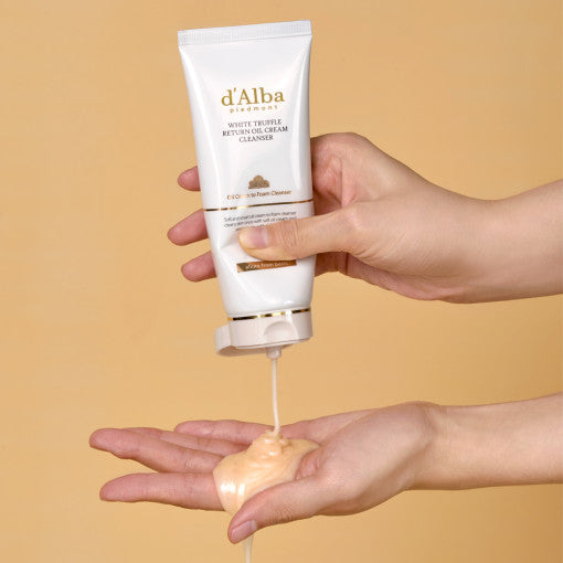 Applying D'ALBA Return Oil Cream Cleanser Tube 100ml on hands for gentle skin cleansing.