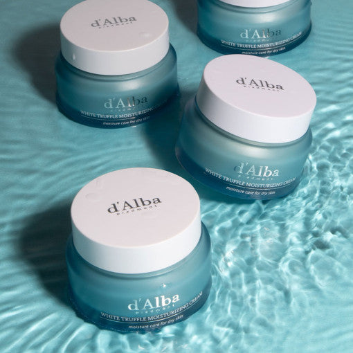 Image of D'ALBA Truffle Moisturizing Cream 50g jars on a blue textured surface