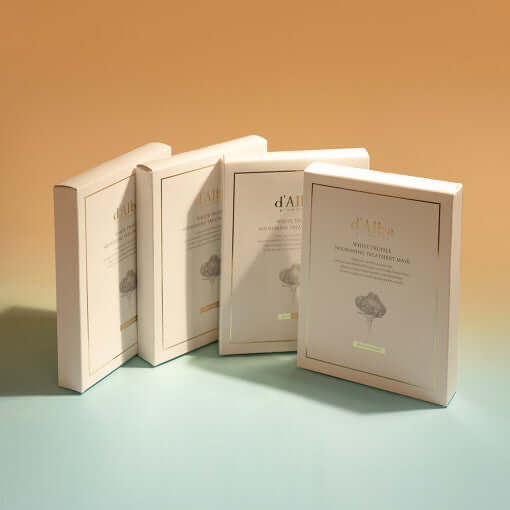 D'ALBA Vegan Nourishing Mask boxes displayed in natural light on a pastel background.