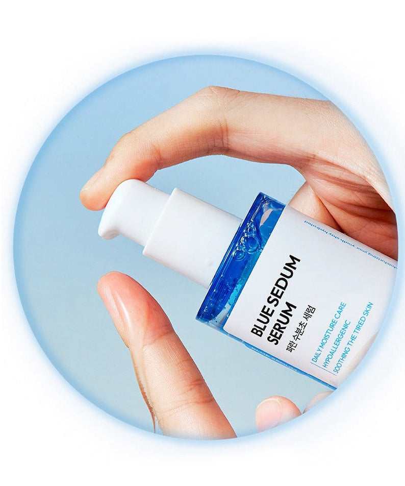 Hand holding DASHU Boy Blue Moisture Serum 65ml bottle against sky background