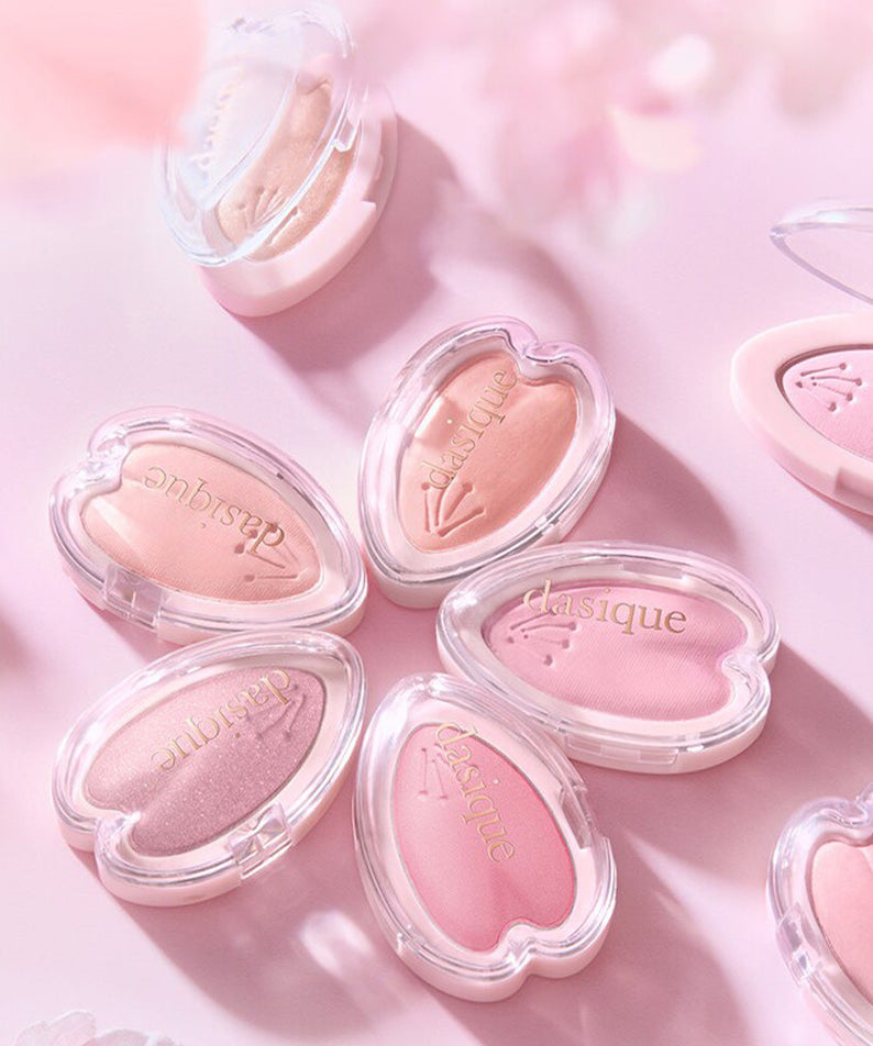 DASIQUE Blooming Single Shadow in various pink shades, perfect for eye makeup, displayed in elegant heart-shaped cases.