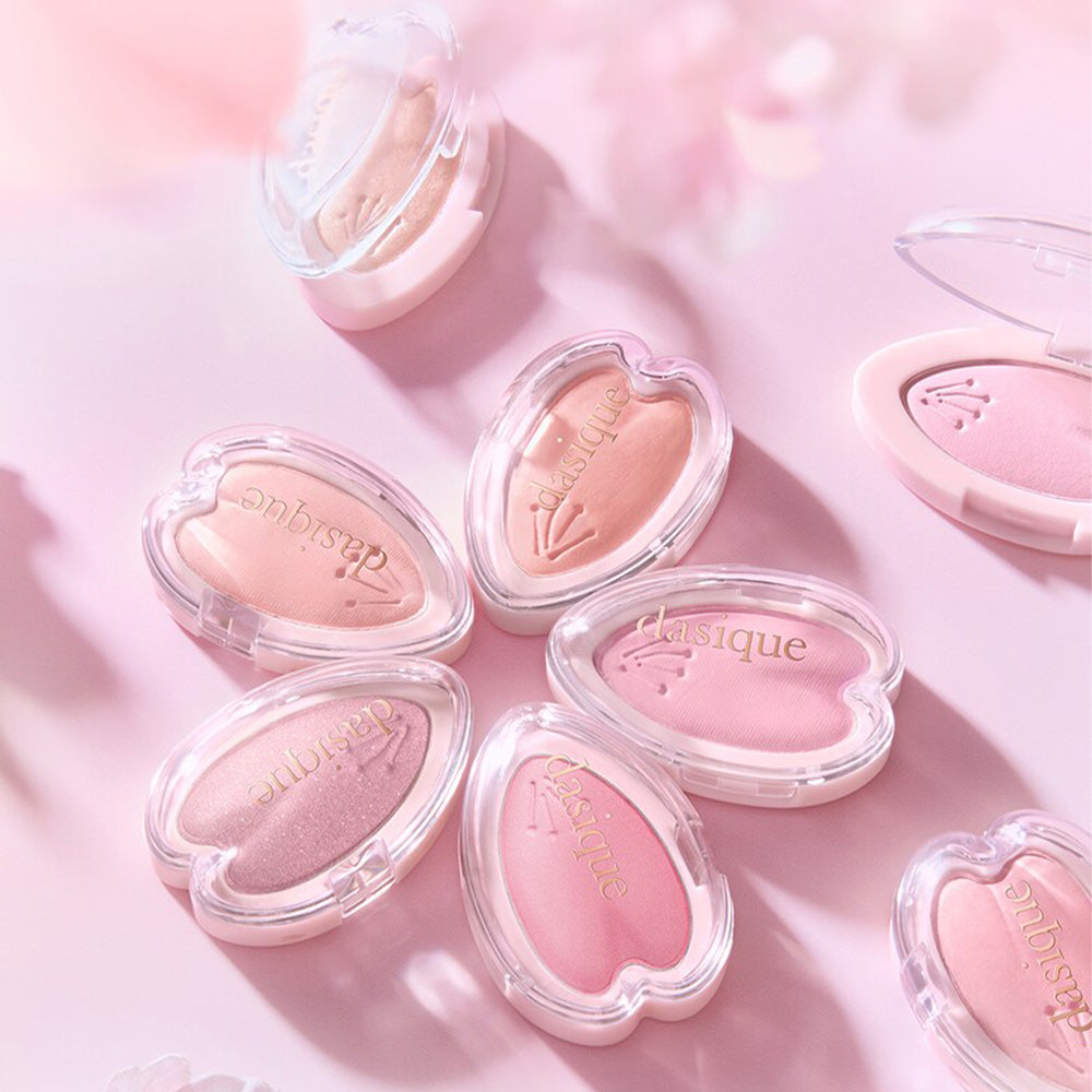 DASIQUE Blooming Single Shadow in various pink shades, perfect for eye makeup, displayed in elegant heart-shaped cases.