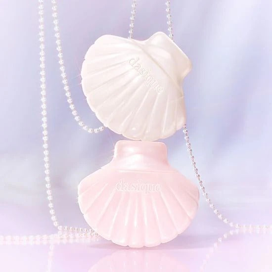 DASIQUE Glow Shell Base in elegant shell-shaped packaging showcasing luxury cosmetic product.