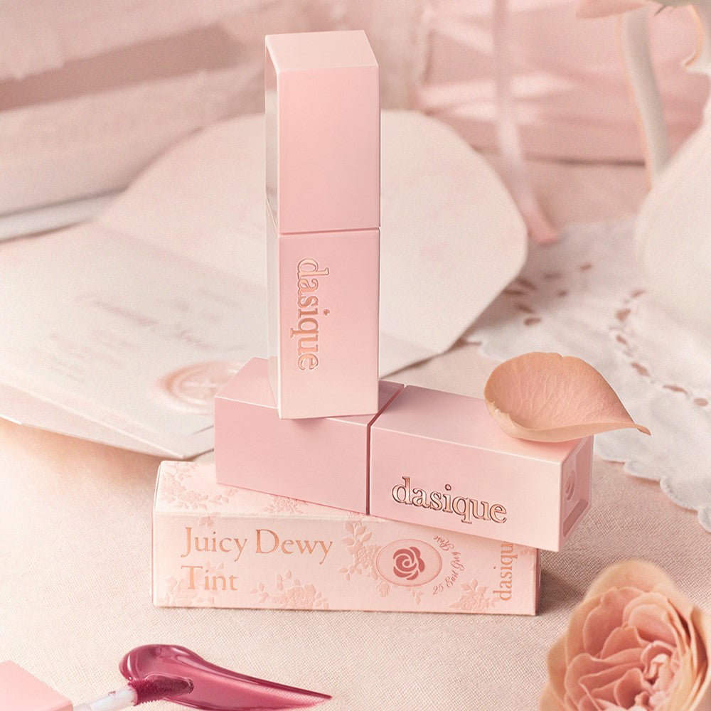DASIQUE Juicy Dewy Tint #RoseMilkTeaCollection in elegant packaging with a delicate rose theme.