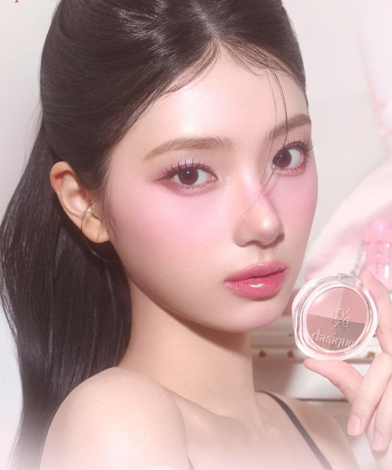 Model holding DASIQUE Multi Quad Shadow showcasing vibrant eye makeup look.