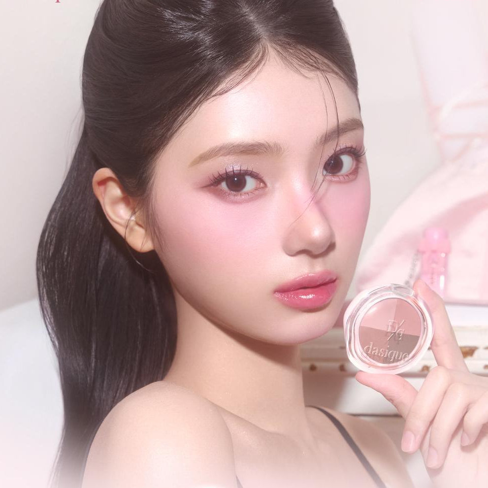 Model holding DASIQUE Multi Quad Shadow showcasing vibrant eye makeup look.