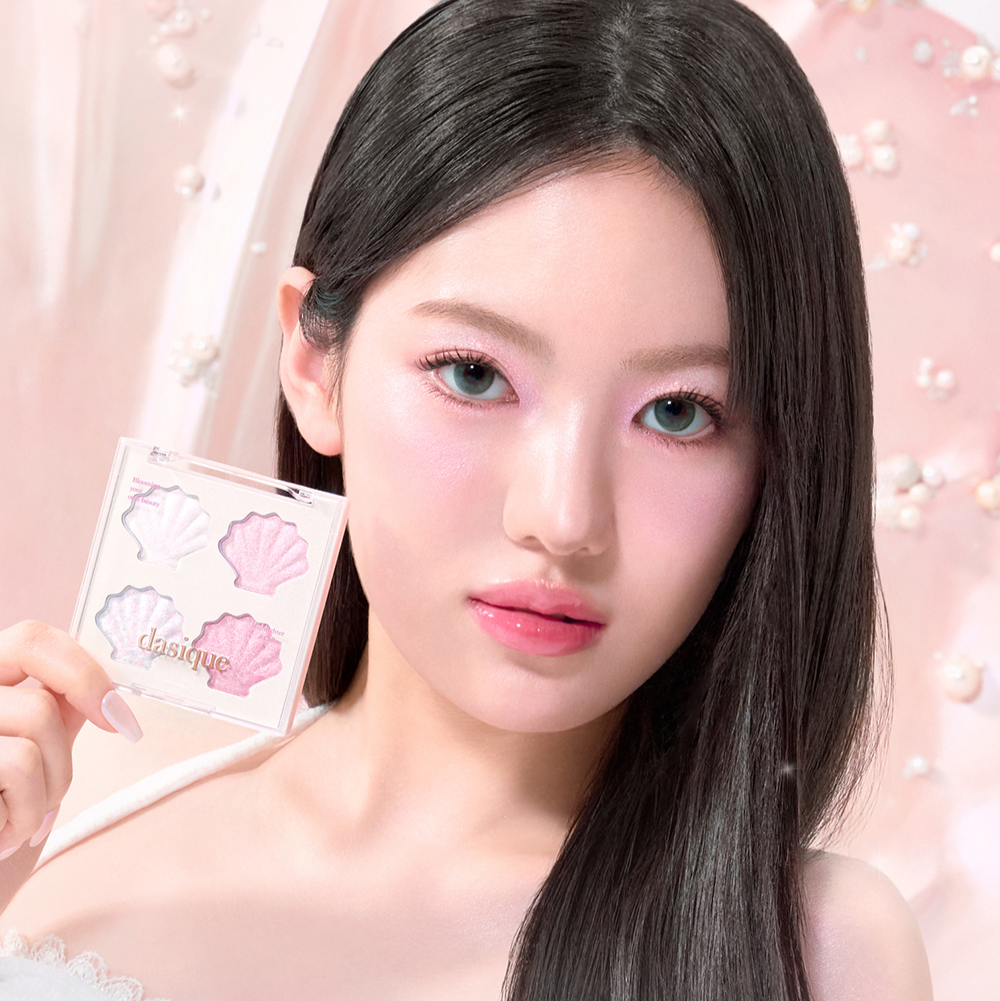 Model holding DASIQUE Shine Glowy Highlighter Palette showcasing makeup application with pastel background.