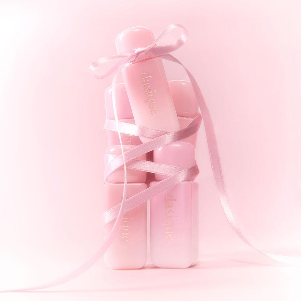 DASIQUE Silky Veil Blush in pink packaging with ribbon, showcasing luxurious cosmetic design.