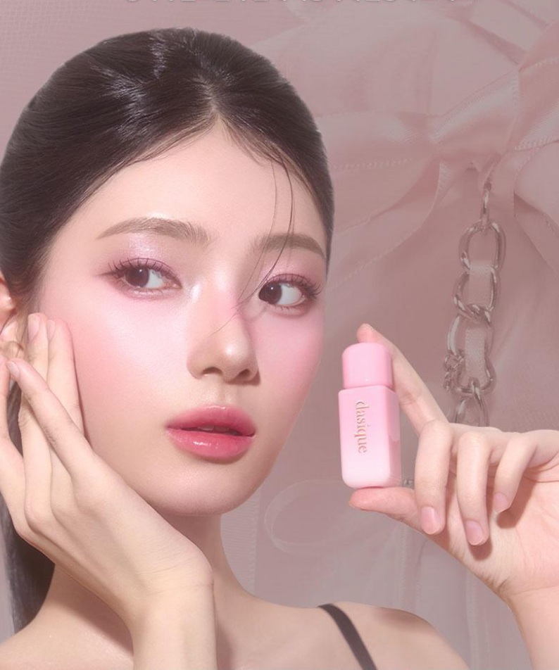 Model holding pink DASIQUE Silky Veil Blush against soft pink background