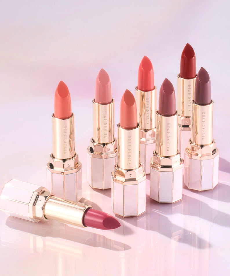 DEAR DAHLIA Lip Paradise Sensual Lip Glow shades displayed with elegant packaging on a light surface.