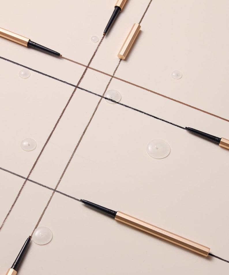 DEAR DAHLIA Perfect Desighning Eyeliner Pencil lying on a neutral background.