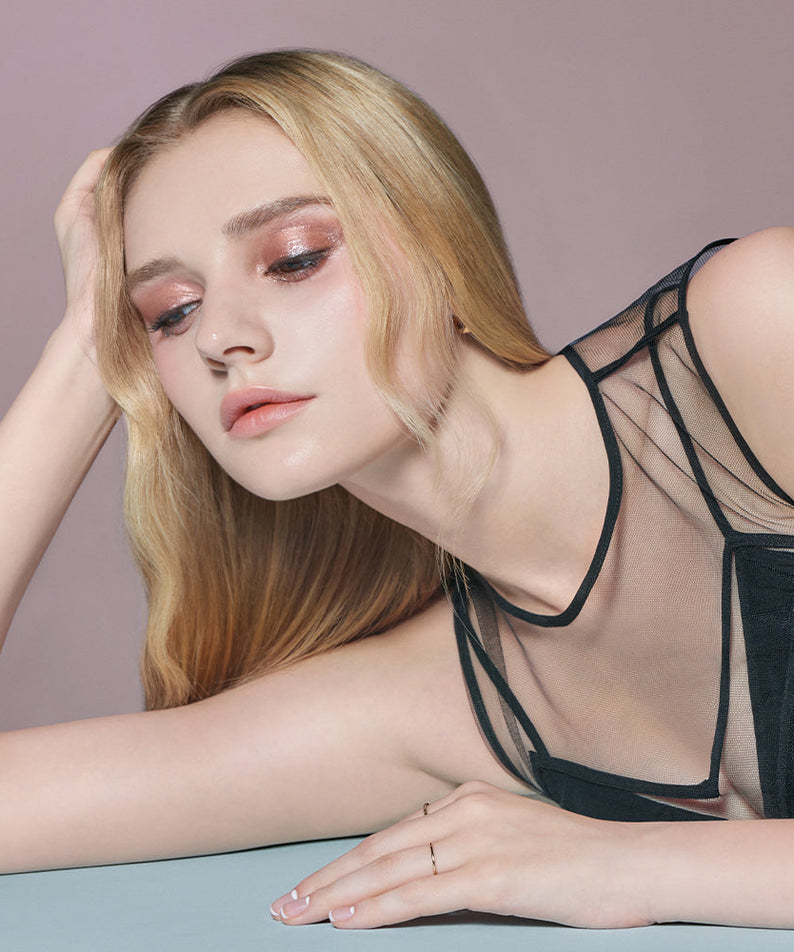 Model showcasing DEAR DAHLIA Perfect Designing Shadow Stick with shimmering eye makeup look.