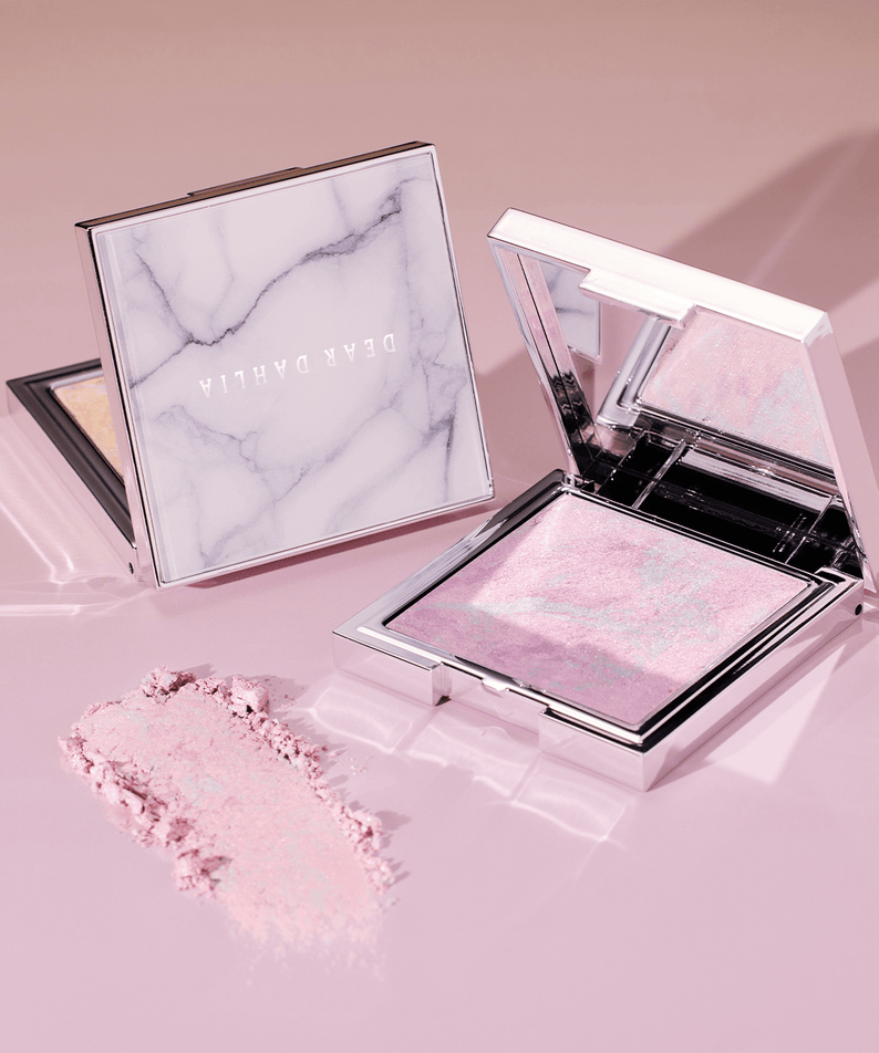 DEAR DAHLIA Skin Luminous Highlighter in elegant compact showcasing shimmering pink tones.