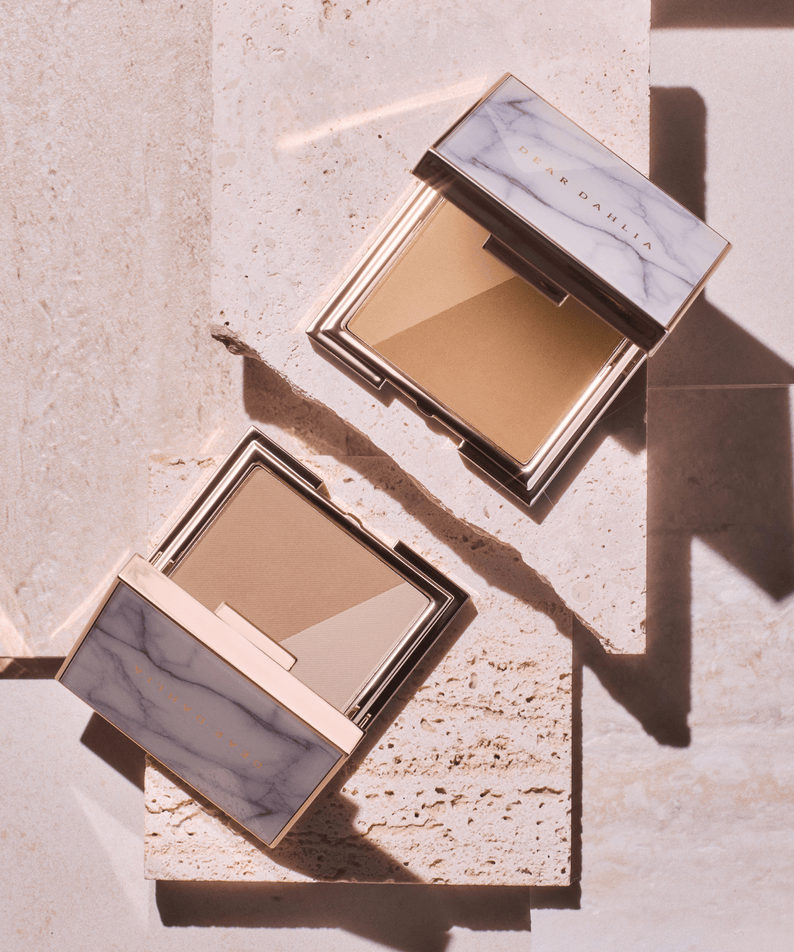 DEAR DAHLIA Skin Silhouette Contour Dou in elegant packaging on a stone surface, showcasing the product design and color tones.