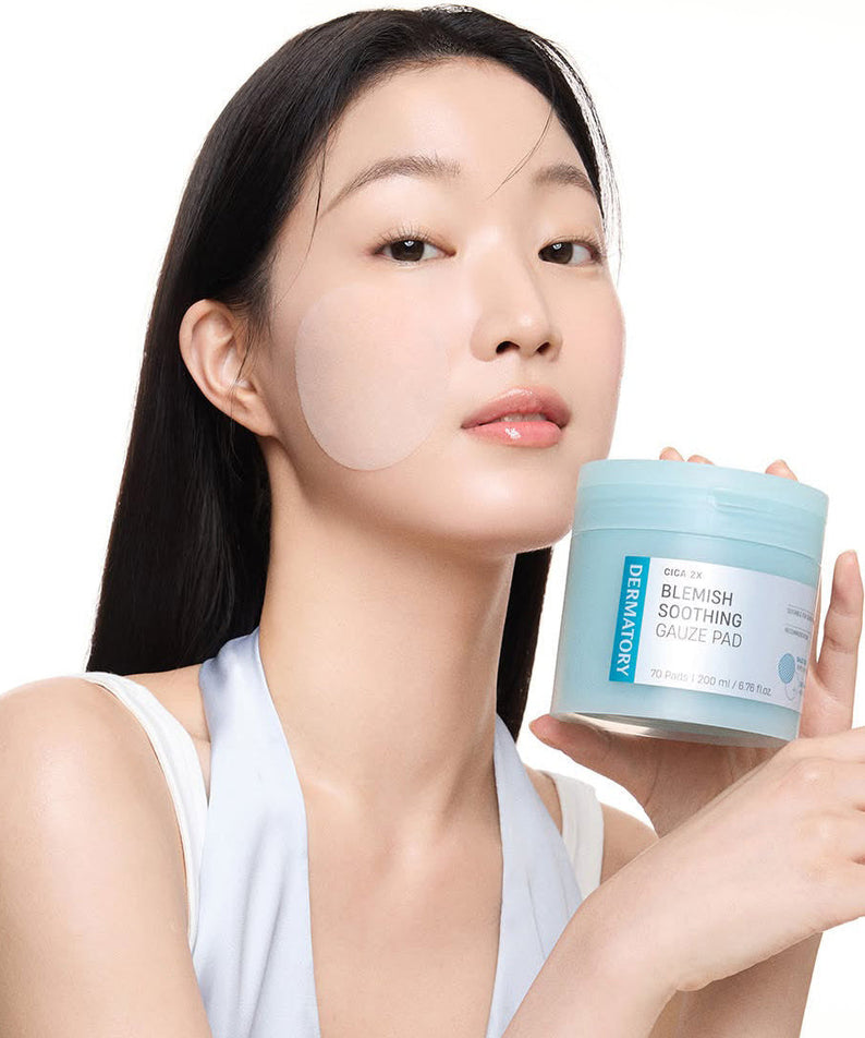 Woman holding DERMATORY Cica Exosome Blemish Soothing Gauze Pad 70 Pads, showcasing skincare product for blemish soothing.
