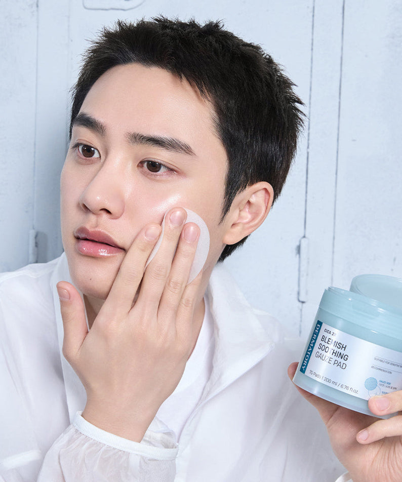 Person applying DERMATORY Cica Exosome Blemish Soothing Gauze Pad 70 Pads to their face.