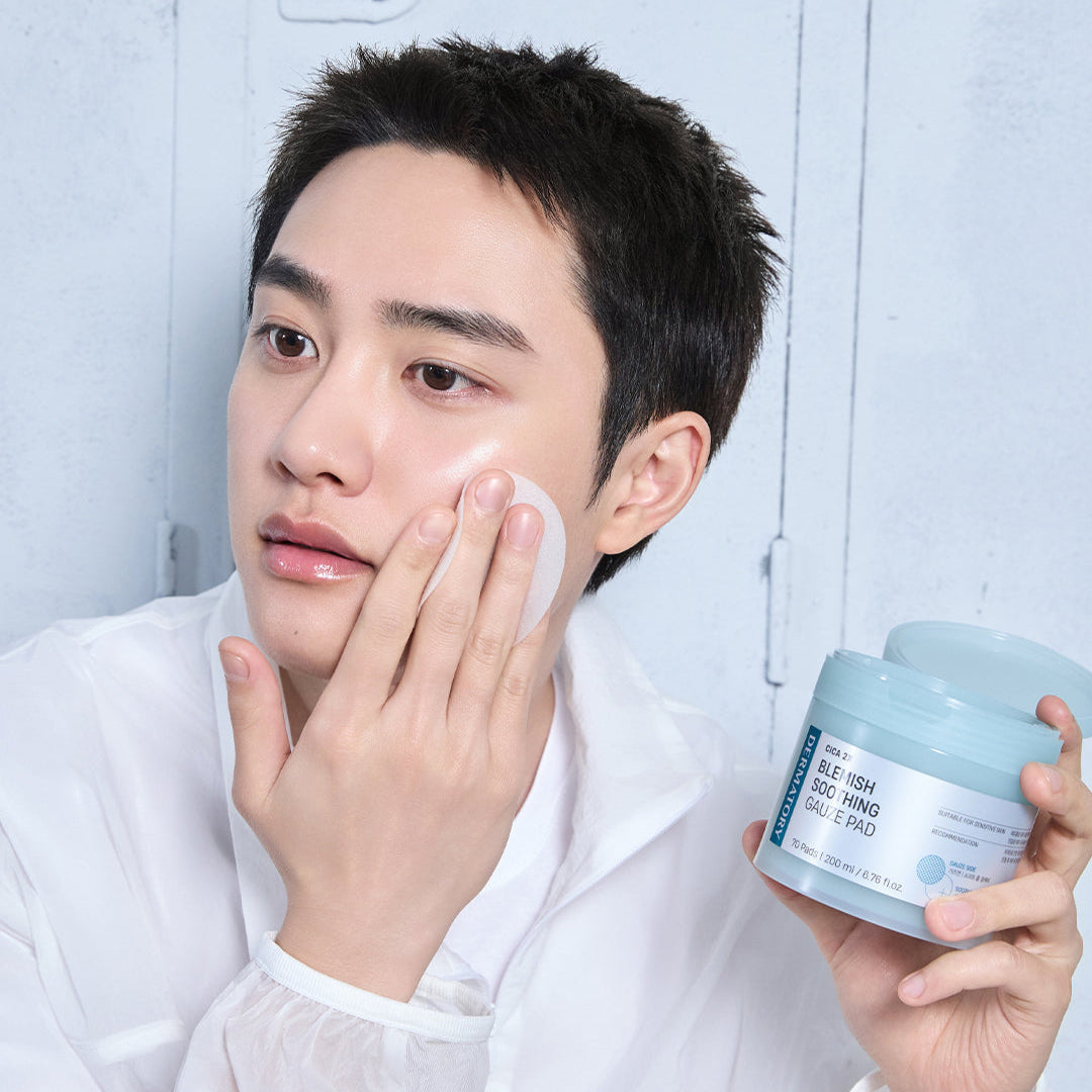 Person applying DERMATORY Cica Exosome Blemish Soothing Gauze Pad 70 Pads to their face.