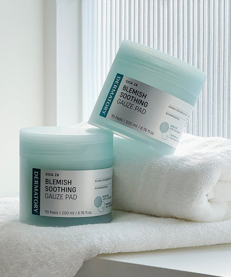 DERMATORY Cica Exosome Blemish Soothing Gauze Pad 70 Pads displayed on a towel with natural light.