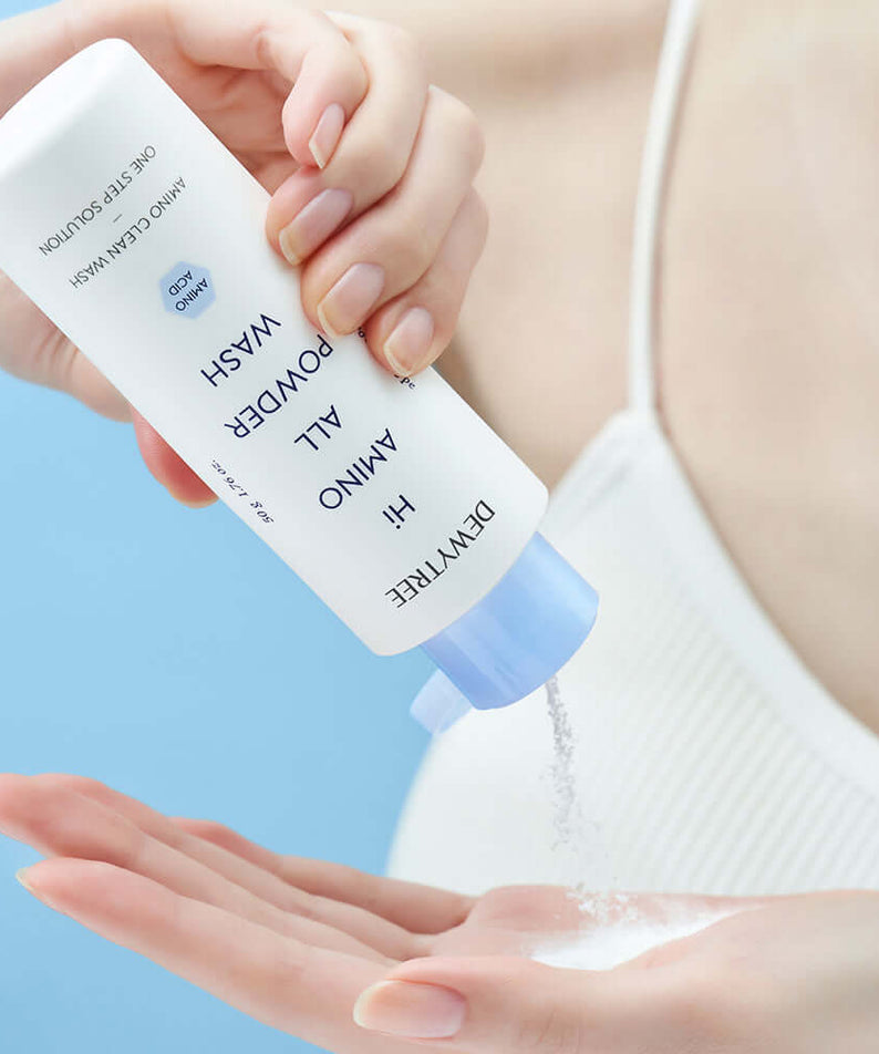 Person pouring DEWYTREE Hi Amino All Enzyme Powder Wash 50g into hand for skincare routine
