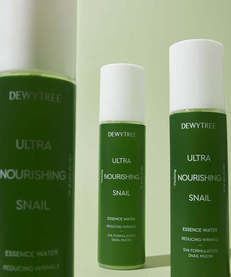 DEWYTREE Ultra Nourishing Snail Essence Water 150ml bottles against a green background.
