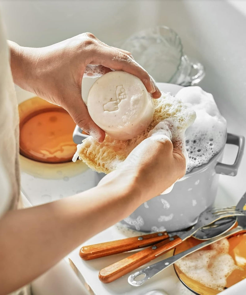 Washing dishes with DONGGUBAT Correct Dishwashing Washing Bar 500g, eco-friendly kitchen cleaning solution.