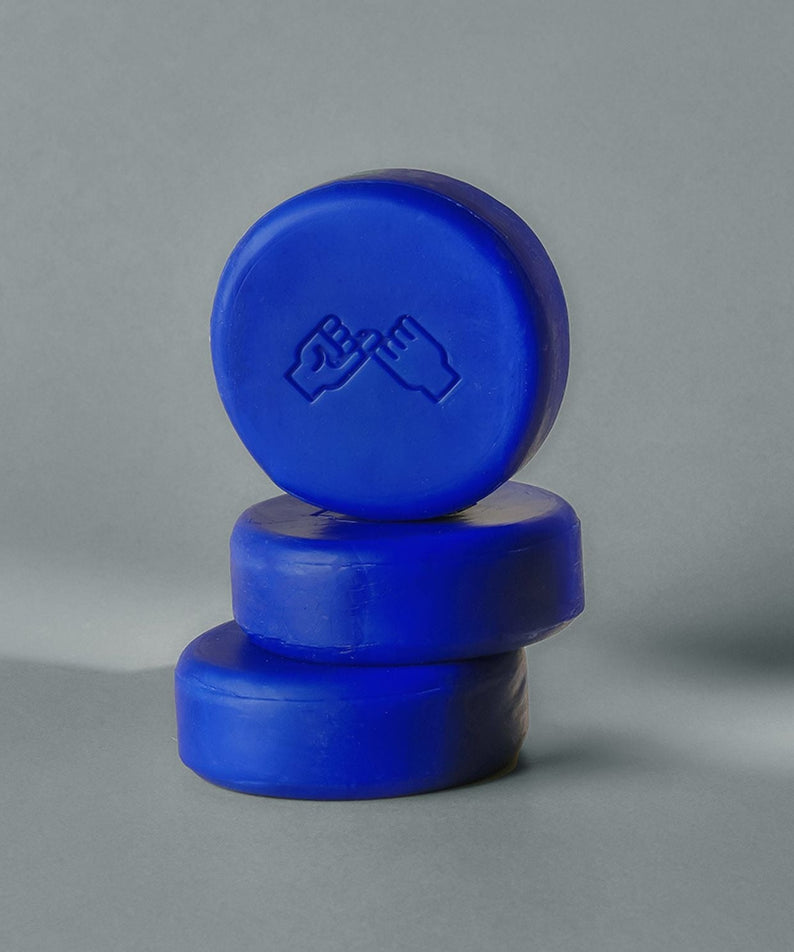 DONGGUBAT Correct Shampoo Bar Cooling stacked on a gray surface with a minimalist design.