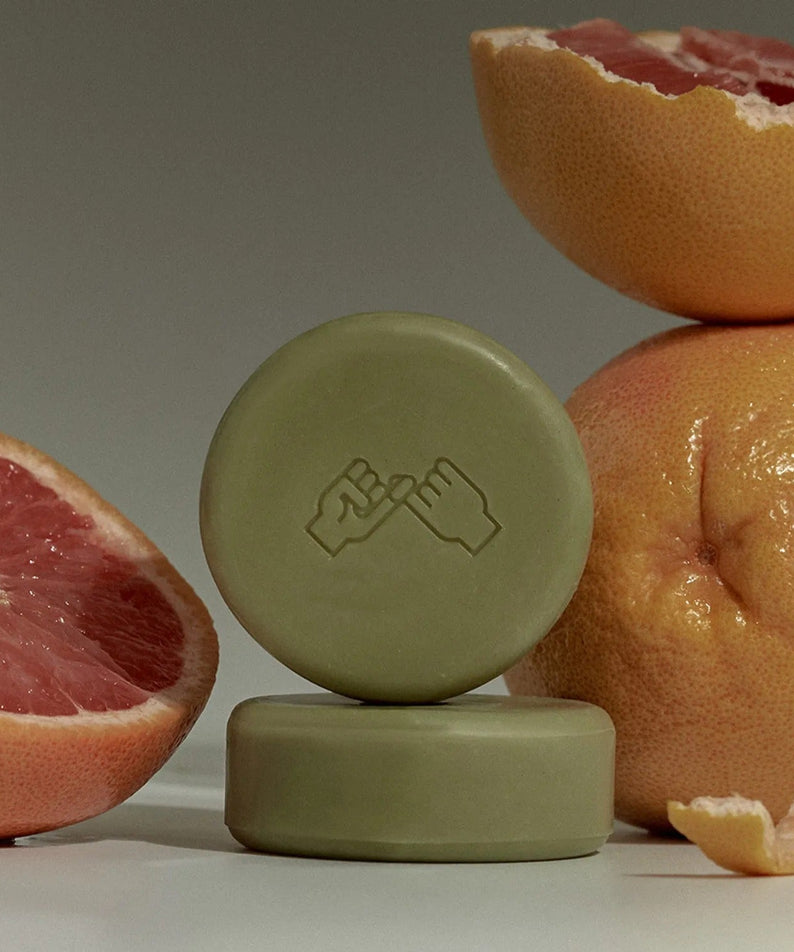 DONGGUBAT Correct Shampoo Bar For Dry Skin with grapefruit background.