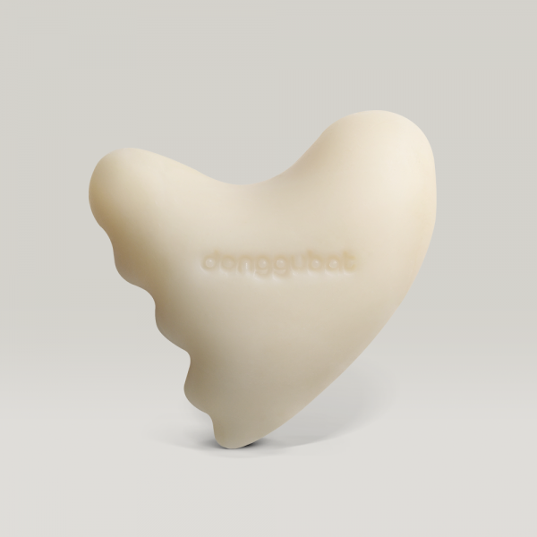 DONGGUBAT Gwalsa Therapy Milky Cleanser Oat 110g in a unique shape for effective skincare routine.