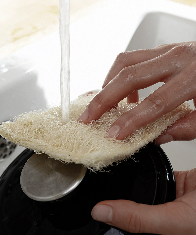 Hands using DONGGUBAT Susemi Basic Type cleaning scrub under running water.