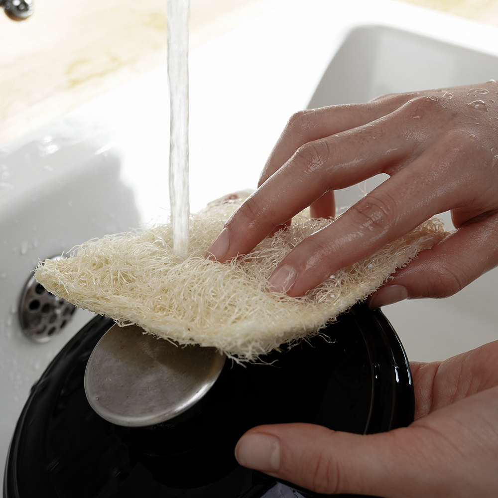 Hands using DONGGUBAT Susemi Basic Type cleaning scrub under running water.