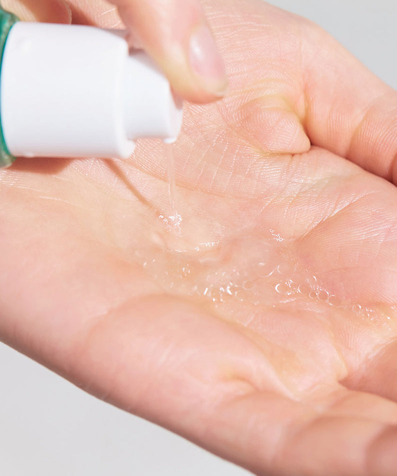 Dispensing DR. JART+ Pore Remedy PHA Exfoliating Serum 30ml onto hand.