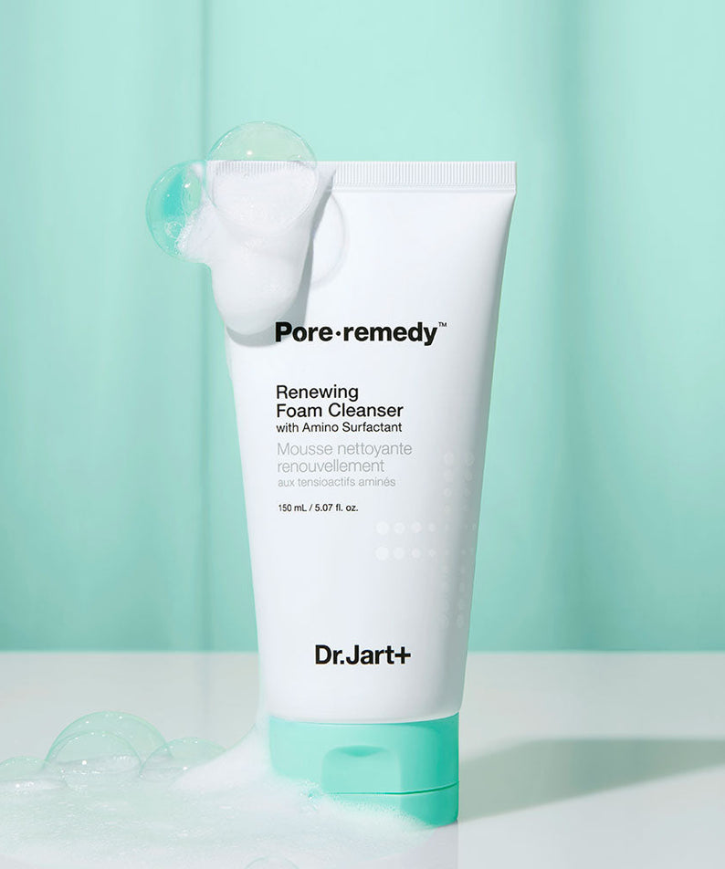 DR. JART+ Pore Remedy Renewing Foam Cleanser 150ml tube with foam bubbles against green background