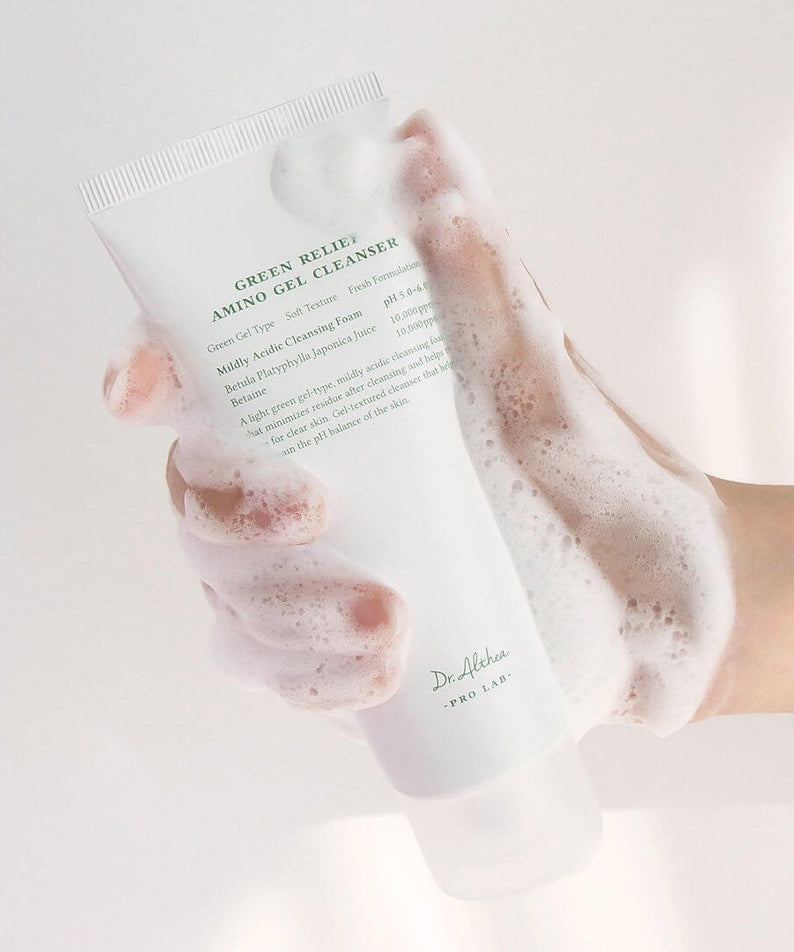 Person holding DR.ALTHEA Green Relief Amino Gel Cleanser 100ml with foam