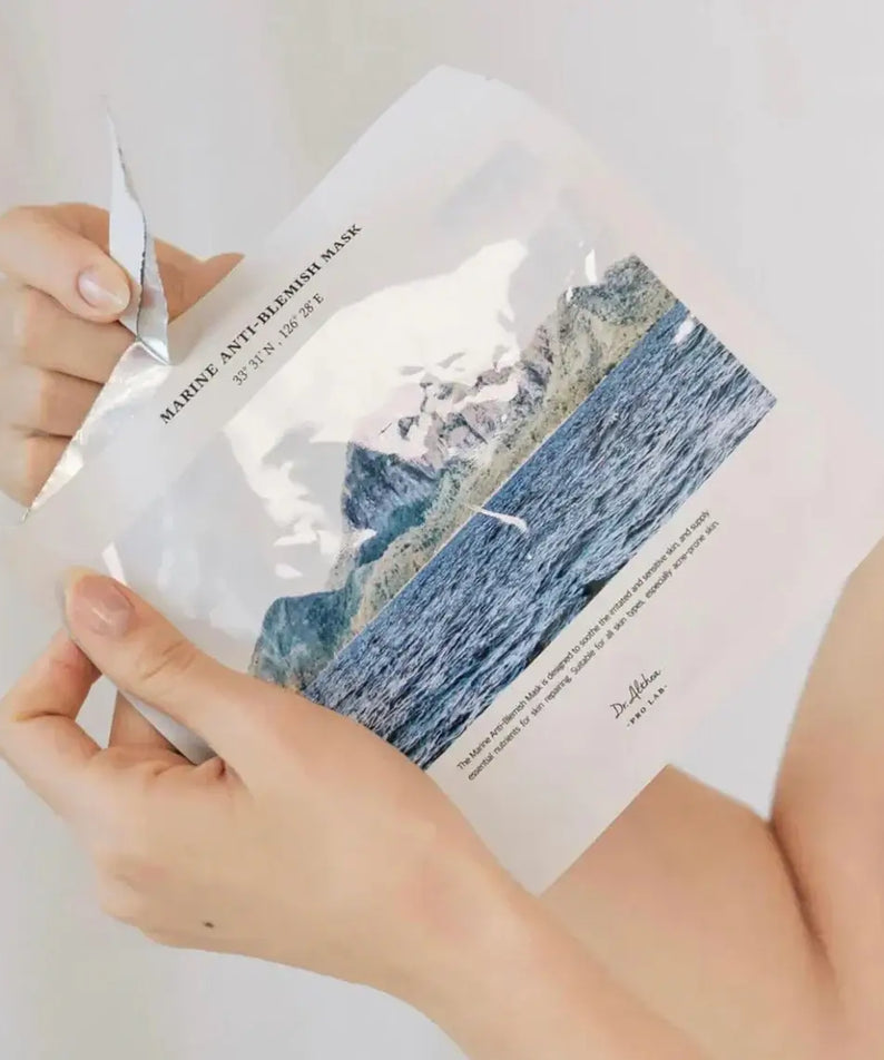 Hands holding DR.ALTHEA Marine Anti Blemish Mask (5ea) skincare product