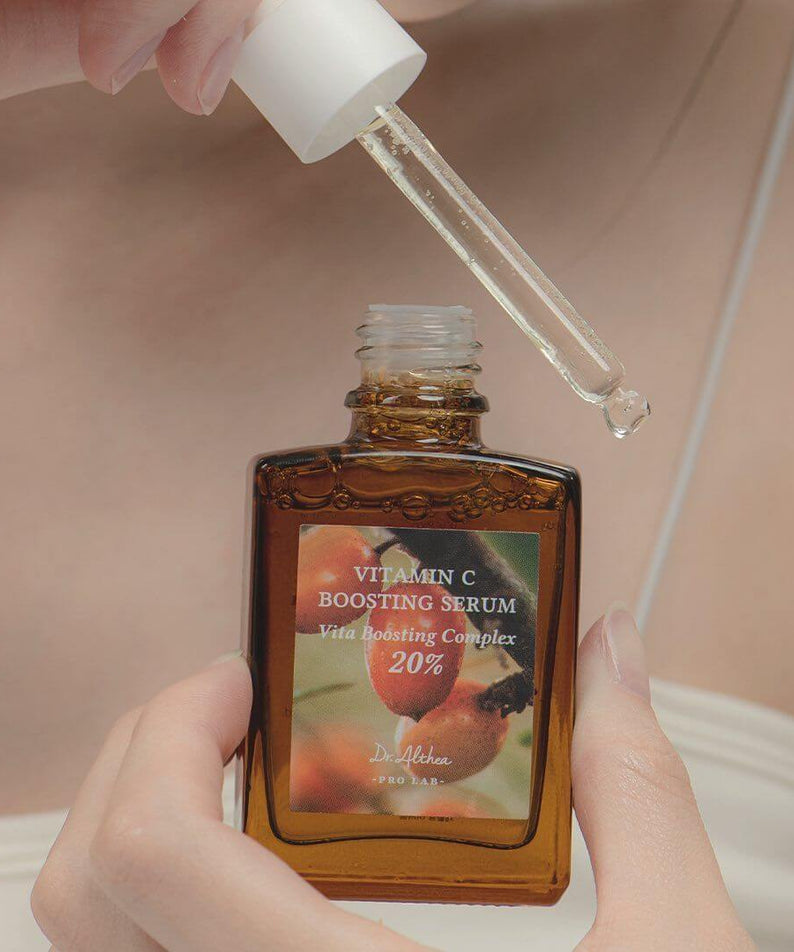 Close-up of DR.ALTHEA Vitamin C Boosting Serum 30ml being applied with dropper