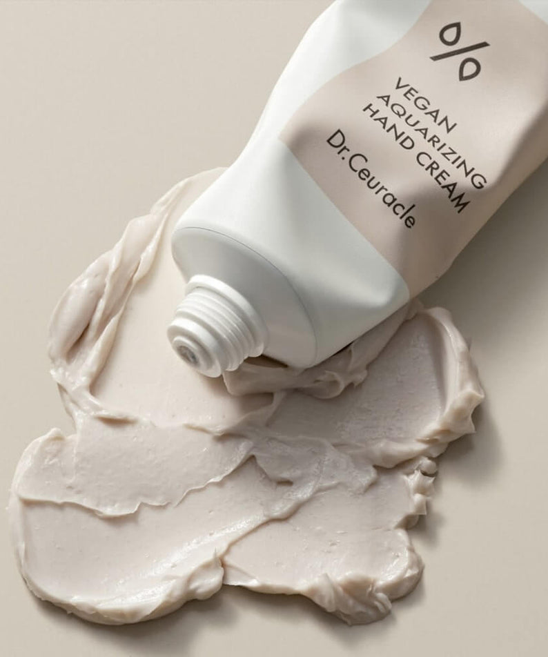 DR.CEURACLE Aqua Rising Hand cream 50ml tube with cream swatch on a neutral background.