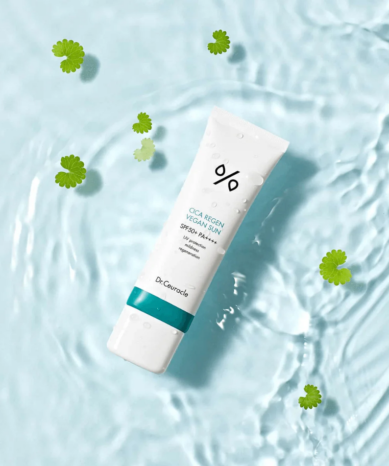 DR.CEURACLE Cica Regan Vegan Sun SPF50+PA++++ 50ml tube on water background with green leaves