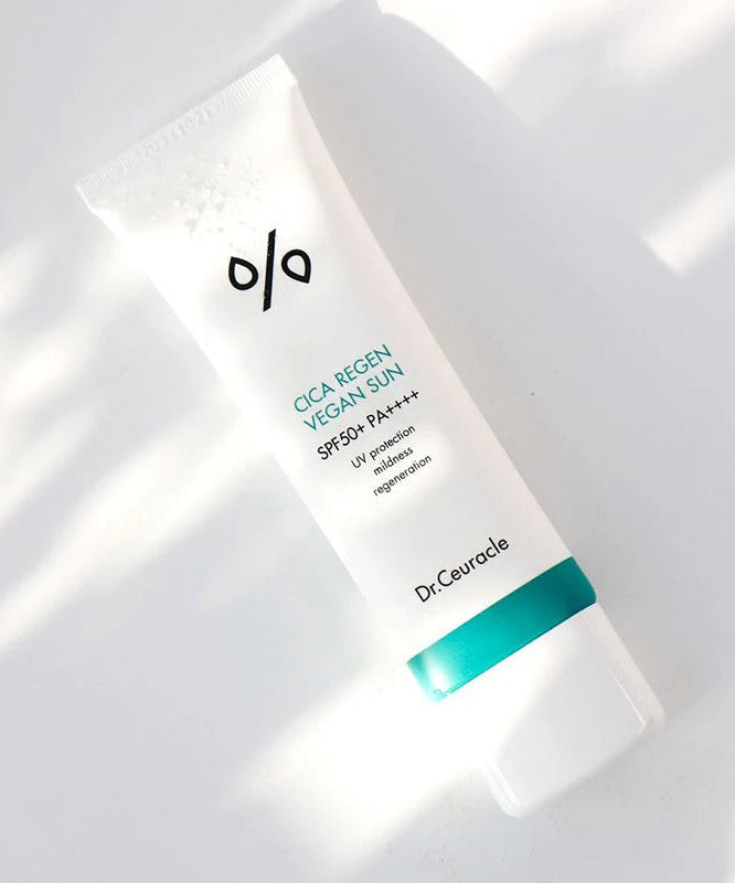 Dr.Ceuracle Cica Regen Vegan Sun SPF50+ PA++++ 50ml in sunlight, highlighting the product's packaging and design.