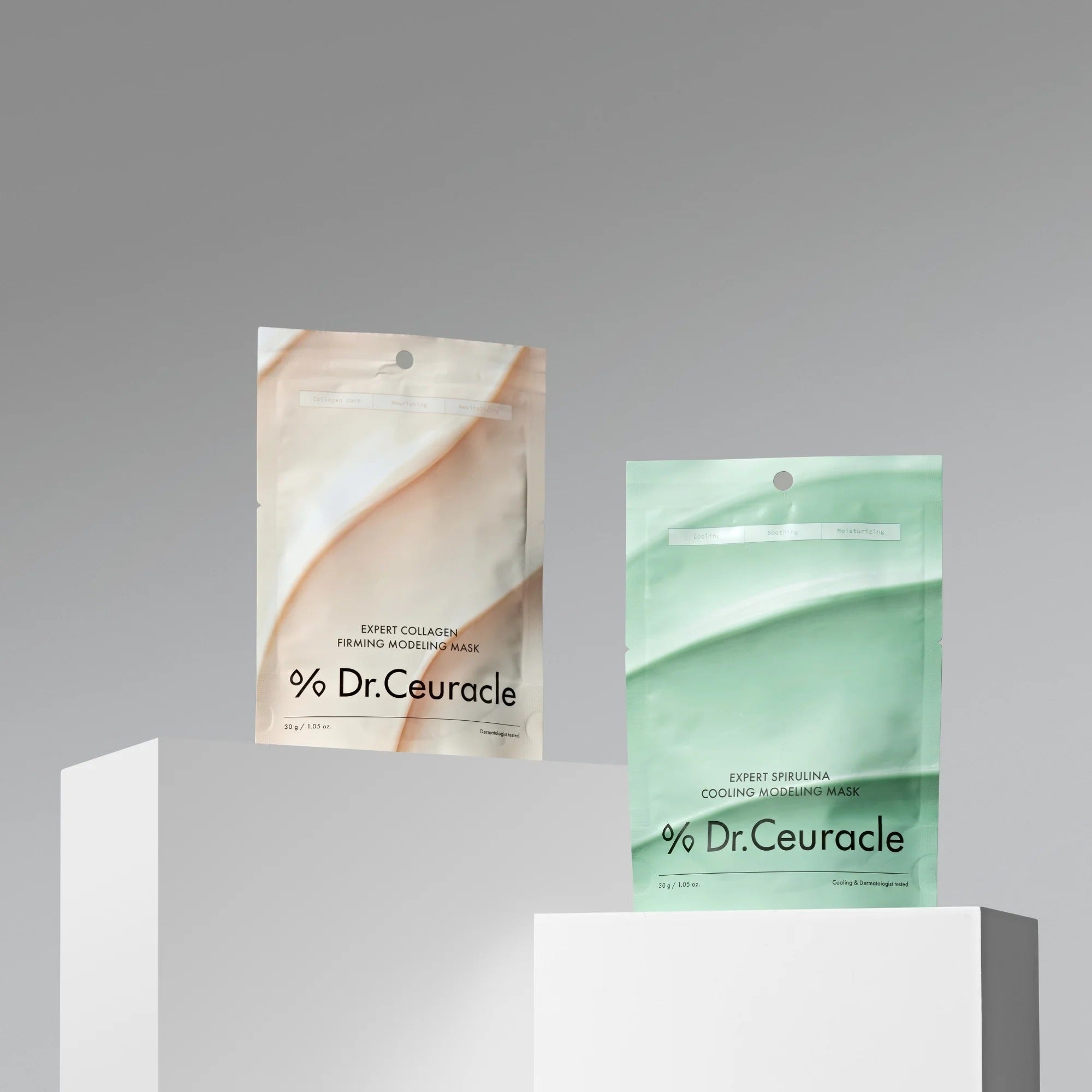 DR.CEURACLE Expert Spirulina Cooling Modeling Mask 30g and another mask on display stand.